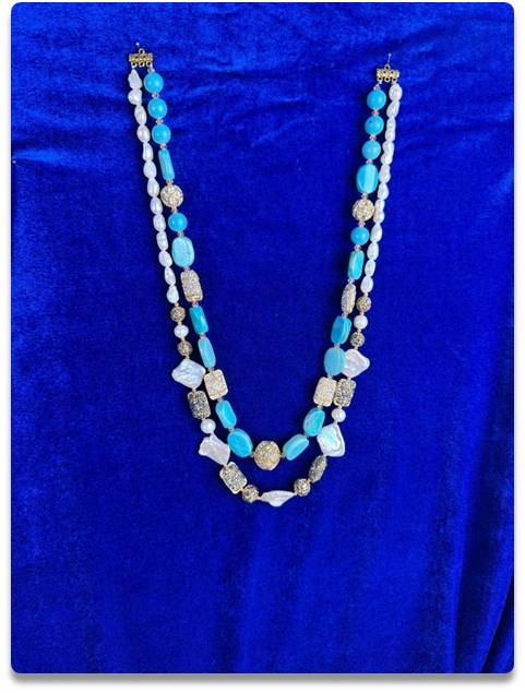 Dual-Strand Necklace with Blue Beads, Pearls, and Gold-Toned Accents