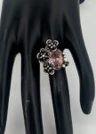 100% pure silver handmade design with the flower oxide color with a pink zirconia stone.