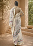 An elegant white saree with delicate floral embroidery for a touch of timeless charm – front