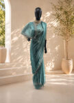 Turquoise Georgette Saree with Silver Zari & Glass Work – Handcrafted Designer Party Wear