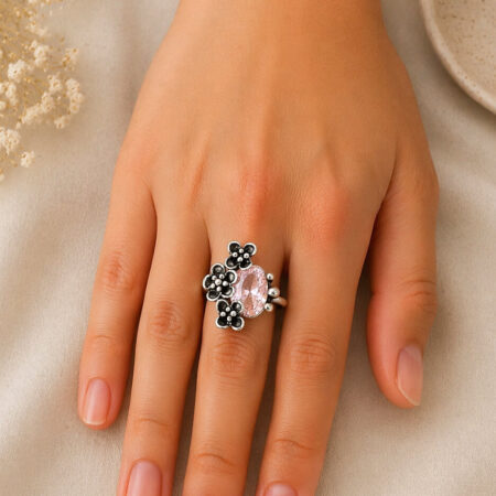 100% pure silver handmade design with the flower oxide color with a pink zirconia stone.