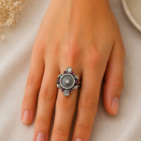100% pure silver war, handmade oxide design on it with small flower and zirconia stone.