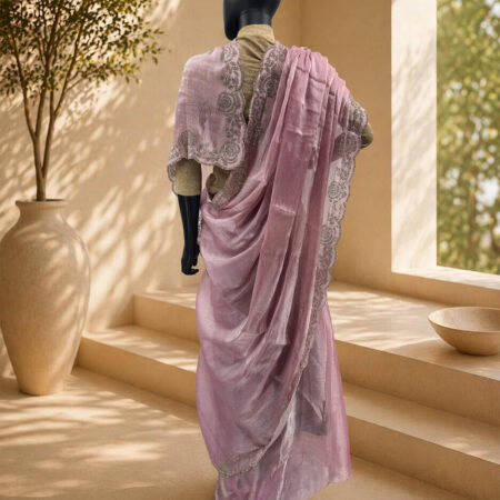 A beautiful baby pink Jimmy Choo jorjet Saree featuring handwoven details and a delicate drape - back