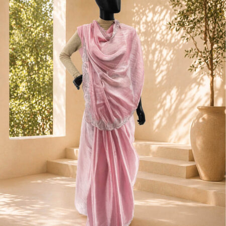 A beautiful baby pink Jimmy Choo jorjet Saree featuring handwoven details and a delicate drape - front