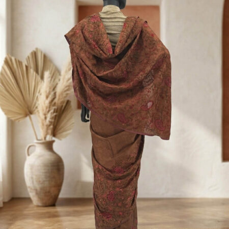 Draped in tradition, this saree weaves a story of timeless elegance with its intricate red embroidery - back