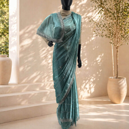 Elegant mannequin in teal sari display - front